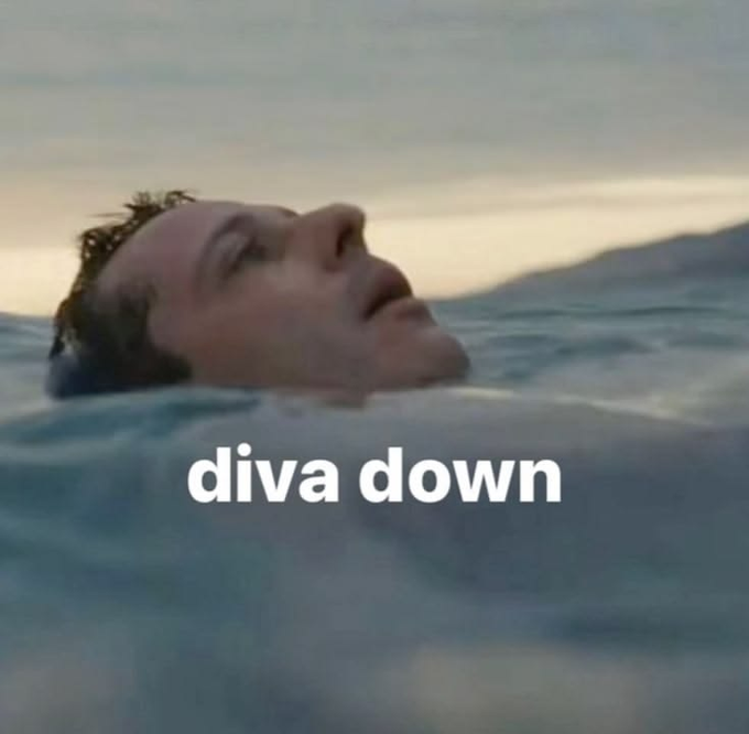 A man's face is partially submerged in water with the text 'diva down' overlaid at the bottom.