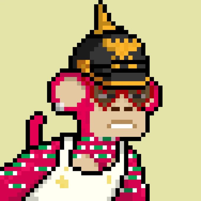 A pixel art character wearing a pointed hat with a star, holding a staff or wand, wearing a pink and green outfit.