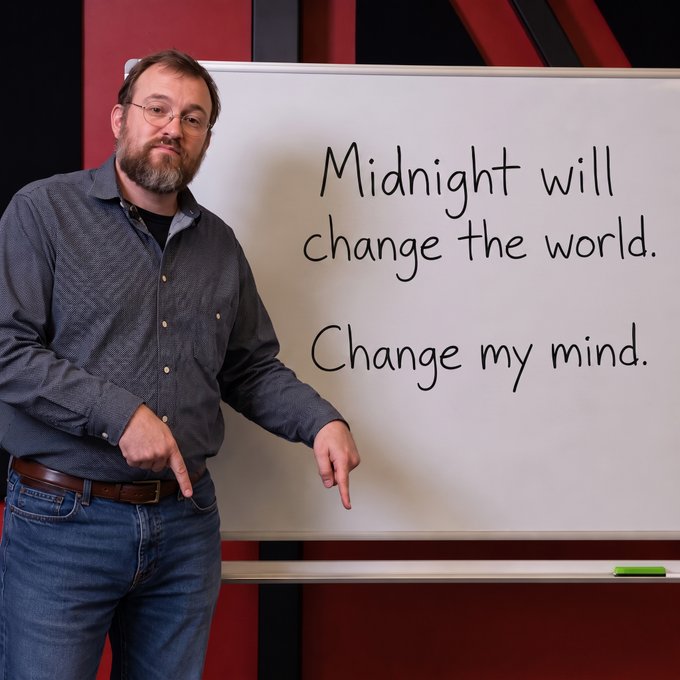 A bearded man in glasses and a blue shirt points at a whiteboard that reads "Midnight will change the world. Change my mind." — parodying the "Change My Mind" meme format to promote the Midnight Network.