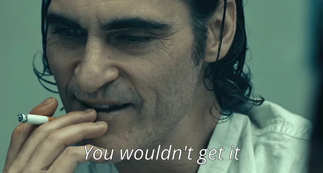 A man with slicked-back dark hair smokes a cigarette with a sly grin, with the subtitle "You wouldn't get it" displayed at the bottom—visually reinforcing the condescending, know-it-all tone of the post mocking someone as a "broccoli head" who couldn't survive BitMEX's 2018 era.
