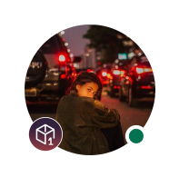 The image features a woman sitting on the ground, surrounded by cars with their headlights on. The background includes various vehicles driving down a street at night. In the top left corner of the image, there's a logo for an online platform called @arc Layer-1, which is a milestone in the development and growth of the ecosystem. The post also mentions that the journey to achieve this milestone has just begun, with points and badges indicating progress towards bigger goals.