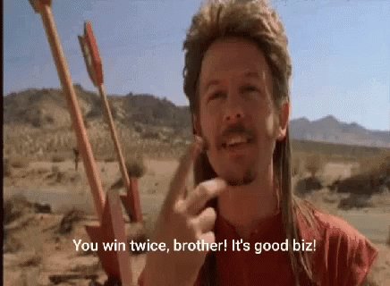 The image features an actor wearing a red shirt with the text "You win twice, brother! It's good biz" written above his head. The actor appears to be making a peace sign with one hand while holding a bow and arrow in the other hand.