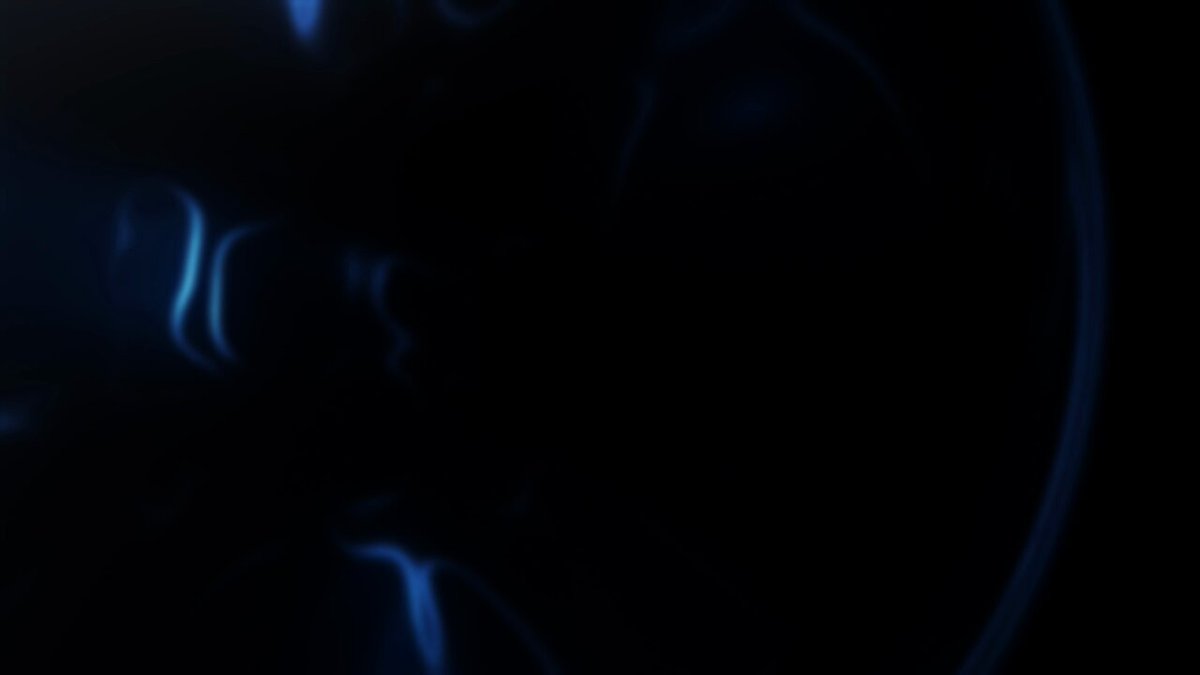 The image shows a close-up of a blue screen with white lines, which appears to be emitting smoke from its center. The background is dark, making the blue screen stand out prominently. There are no other objects or texts present in the image.