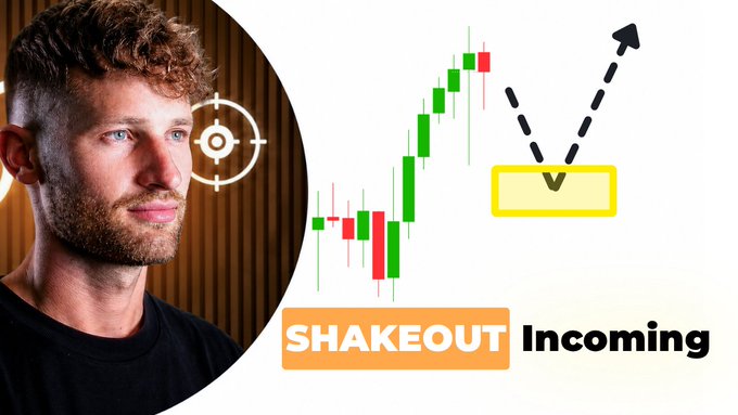 A man with curly hair is pictured on the left next to a financial chart showing candlestick patterns and arrows, with the text "SHAKEOUT Incoming" displayed below. The image relates to the post by suggesting a volatile or corrective downward price movement is expected for Bitcoin.