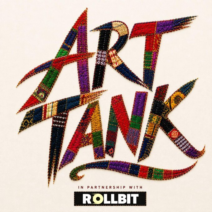Vibrant embroidered artwork spelling out "ART TANK" in colorful patchwork letters, with the text "IN PARTNERSHIP WITH ROLLBIT" displayed at the bottom. The image serves as a branded promotional graphic for the Art Tank guest curator initiative in partnership with Rollbit.