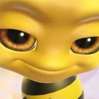 A close-up of a yellow cartoon bee toy with large brown eyes.