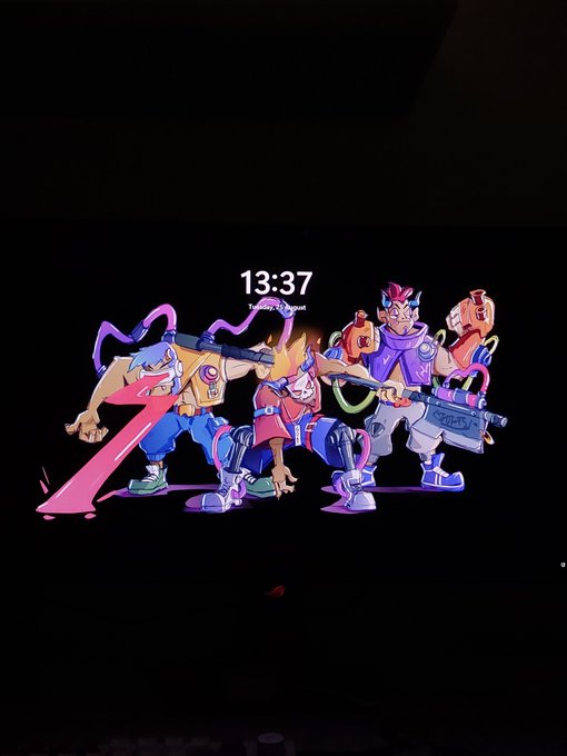 A lock screen displaying colorful, cyberpunk-style animated artwork of four punk characters against a black background, with the time shown as 13:37.