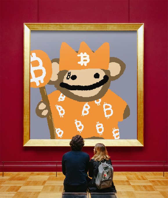 Two people sit on a bench in a museum gallery, viewing a large framed pixel-art painting of a monkey wearing Bitcoin-logo clothing and holding a Bitcoin coin staff.