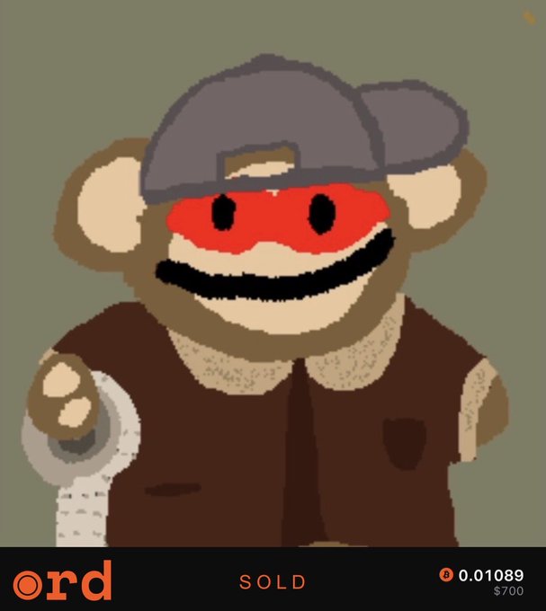 The image features a cartoon monkey wearing a hat and holding a roll of toilet paper. The monkey appears to be smiling, giving off a friendly vibe. The caption below the image reads "SOLD", indicating that this particular item has been sold.