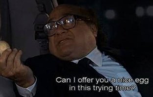 A movie character wearing glasses and a suit holds an egg, with subtitles reading "Can I offer you a nice egg in this trying time?"