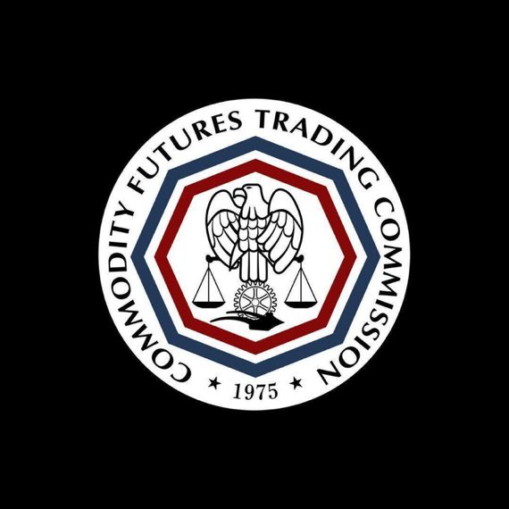 The official seal of the Commodity Futures Trading Commission (CFTC) features an eagle with scales, the year 1975, and blue and red octagonal borders on a black background.