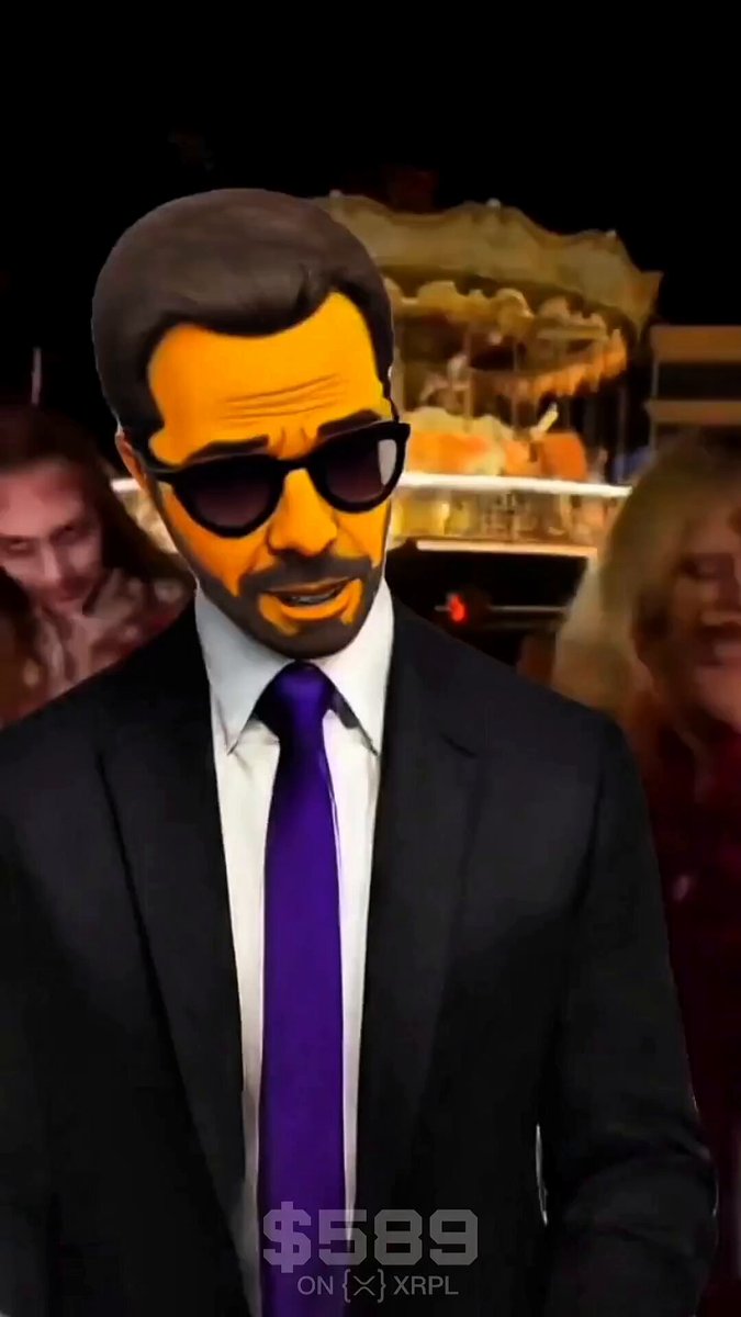 A man wearing sunglasses, a black suit, and a purple tie is walking into an office building with his hands behind his back. The image also includes a link to the post that reads "How I'm walking into work when XRP hits $589". This message seems to be related to the video of the man in the suit talking on the phone while wearing sunglasses, as it suggests a connection between the scene depicted and an event involving cryptocurrency.