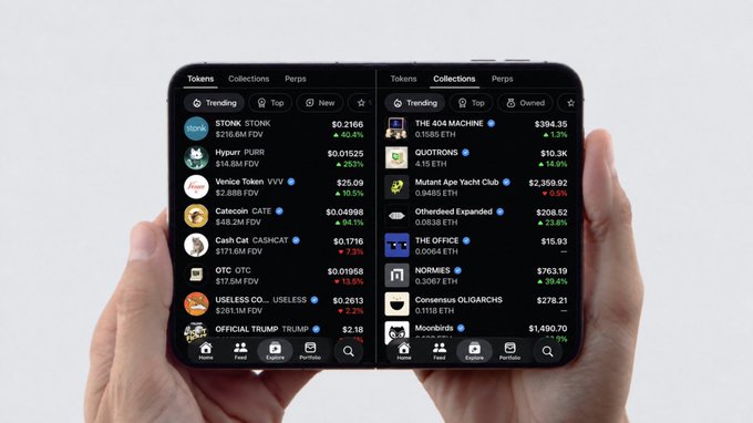 A person holds a large, foldable smartphone displaying two cryptocurrency trading apps with lists of tokens, including 'STONK', 'PURR', and 'THE 404 MACHINE'.