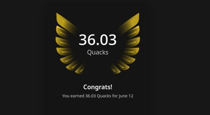 The image shows a large gold bird with a pair of wings spread out, giving it a prominent position in the center of the frame. Surrounding this bird is text that reads "Congratulations! You earned 36 Quacks for June 12". The bird itself appears to be waving and holding its wings aloft in the middle of the image. The entire scene seems to revolve around quacking birds, symbolizing a game or achievement related to these avian creatures.