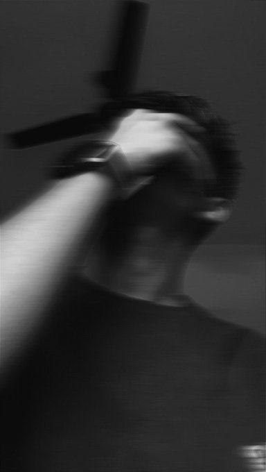 The image shows a person holding a gun, with their head tilted back as if they are about to shoot something or someone. The photo has been edited to appear blurry, giving it a dreamy quality. The caption of the image reads "Hey Good Afternoon buddy The Arc Terminal is slowly getting stronger ... Mindshare 1000 Users Campaign launched ... 150K USDC Reward Pool ... Emphasis on community and ecosystem growth @TheARCTERMINAL is working towards creating not".