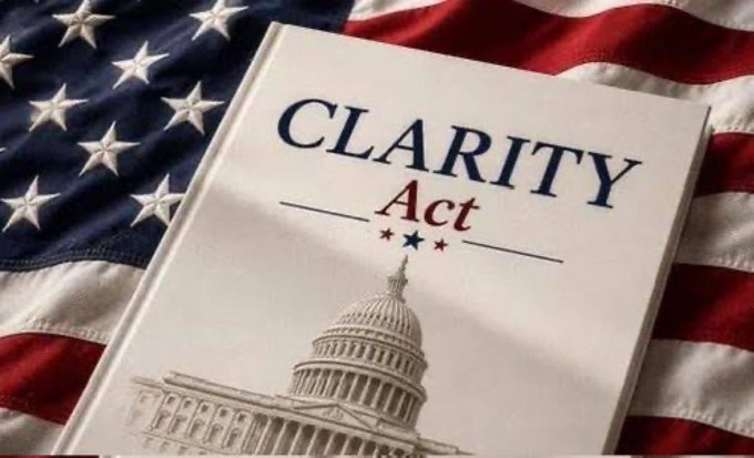 A document titled 'CLARITY Act' featuring the U.S. Capitol building rests on top of an American flag.