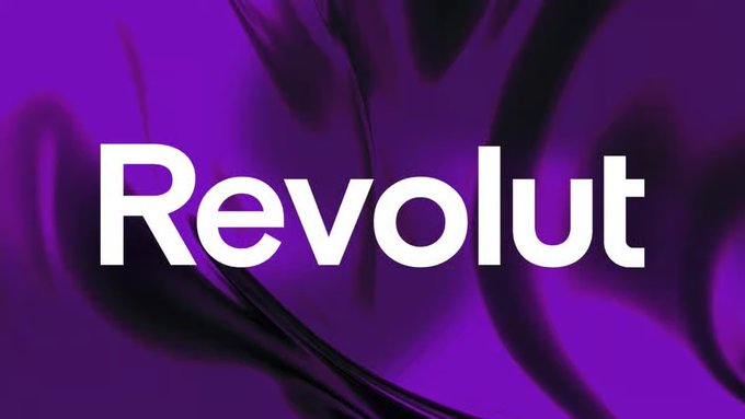 The image displays the white text "Revolut" against a purple, abstract background, which graphically represents the fintech company mentioned in the accompanying news. This visual ties directly into the announcement of Revolut receiving in-principle approval from Dubai's VARA to offer crypto services.