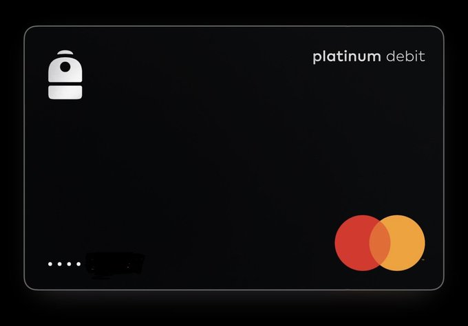 A sleek black 'platinum debit' card design featuring a padlock icon and Mastercard logo in the bottom right corner.