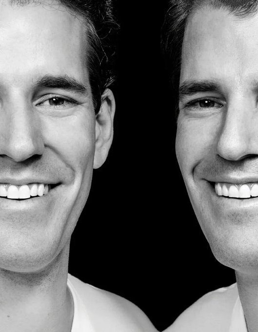 Two men smile broadly in a close-up black-and-white portrait, their faces filling the frame against a dark background. The upbeat, cheerful expressions visually reinforce the post's message of minimal, consumer-friendly fees at just 0.25%.