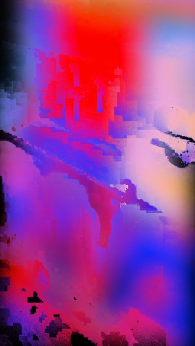 An abstract, blurry image with vibrant red, blue, and purple hues creating a chaotic, colorful pattern.
