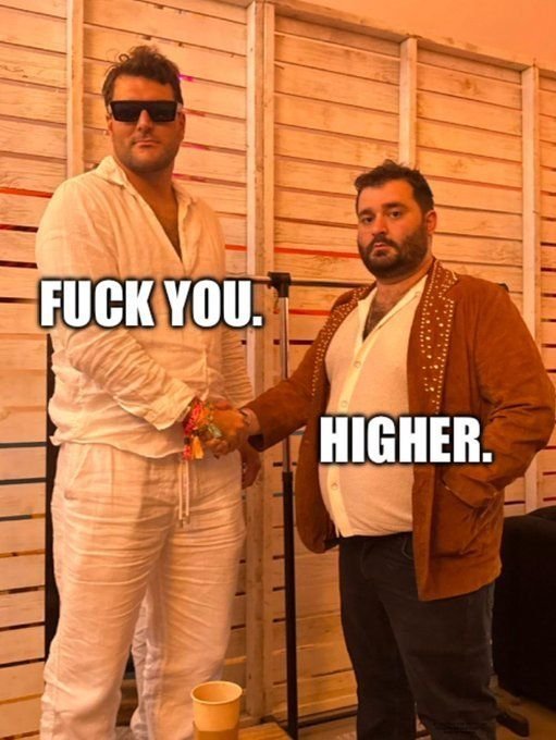 The image shows two men standing together in what appears to be a backstage area—one in a white shirt with sunglasses and another in a brown studded jacket—shaking hands while the text "FUCK YOU. HIGHER." is overlaid in bold white letters. The meme humorously conveys aggressive bullish confidence toward both skeptics and believers of the $BSTONK token, with the handshake symbolizing the stock being "clocked" (recognized) regardless of one's stance.