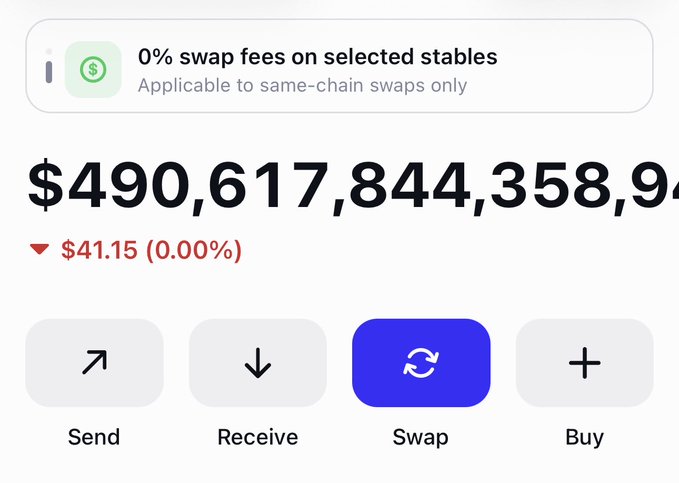 A cryptocurrency wallet app screen shows a balance of $490,617,844,358 with a 0.00% change, a notification about 0% swap fees on selected stables, and buttons for Send, Receive, Swap, and Buy.