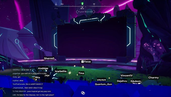 A screenshot of a video game stream showing a futuristic landscape with a "Pulse District" map and chat messages from viewers like "ShermO" and "KodApe".