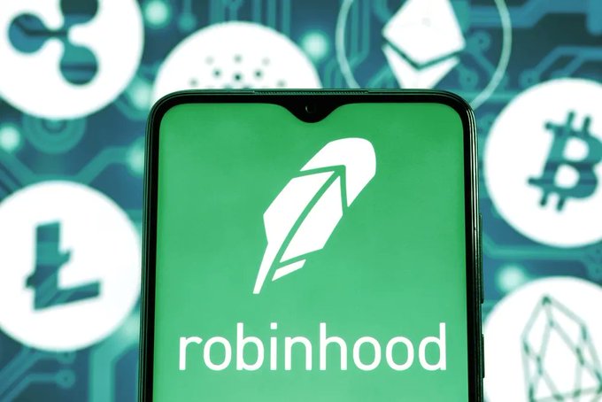 A smartphone displaying the green Robinhood app logo, surrounded by cryptocurrency symbols including Bitcoin, Ripple, and Litecoin.