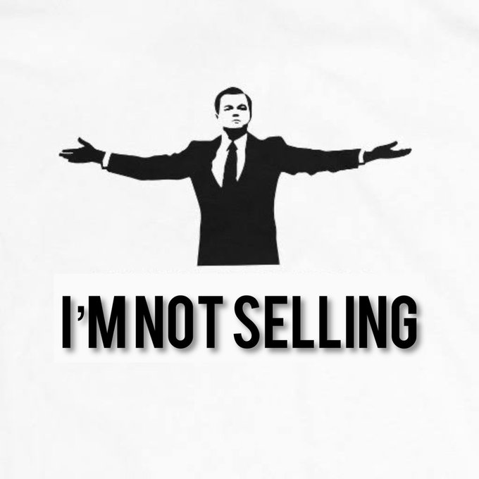 This image features a black and white graphic of a man in a suit with open arms, accompanied by the bold text "I'M NOT SELLING." The graphic visually represents the sentiment of the post, which encourages support for holding onto #LUNC (Terra Classic) cryptocurrency.