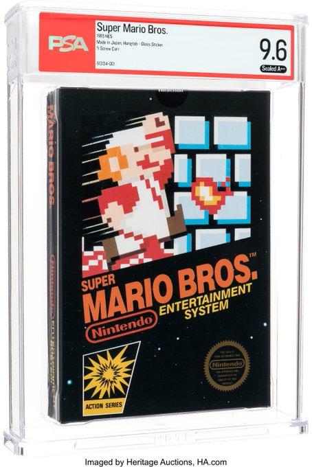 The image shows an older video game console, specifically Nintendo Super Mario Bros., being sold at auction by Heritage Auctions for $9.6 million.