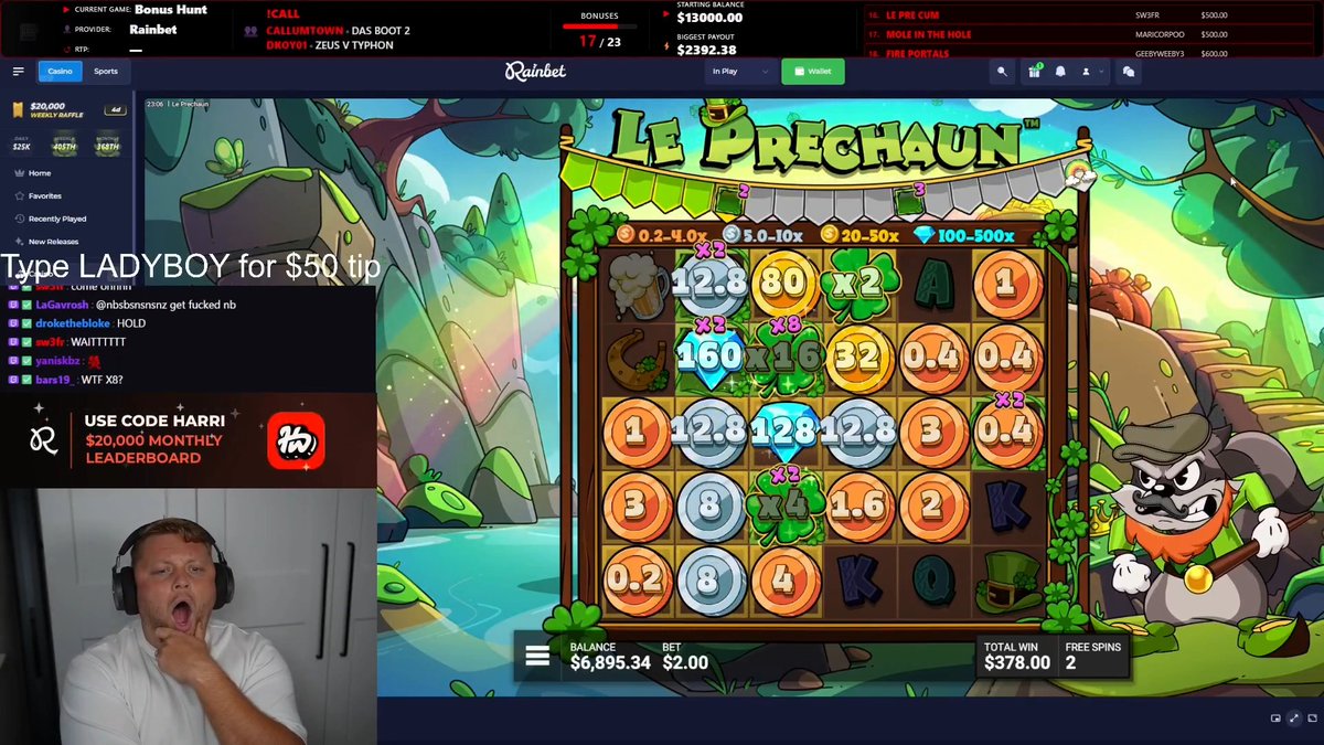 A streamer is shown mid-reaction, appearing shocked with his mouth open, while playing "Le Prechaun" slot game with a balance of $6,895.34 and a total win of $378.00 displayed on screen, alongside a chat message reading "Type LADYBOY for $50 tip." The image captures the moment HarriWagers reacted to a major win, consistent with his jumping out of his chair upon realizing his $2 bet turned into a significant payout on Rainbet.