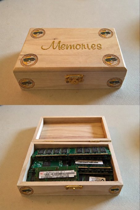 A wooden keepsake box labeled 'Memories' in gold script on top, shown closed and then open to reveal it has been creatively repurposed to store computer RAM modules instead of mementos.