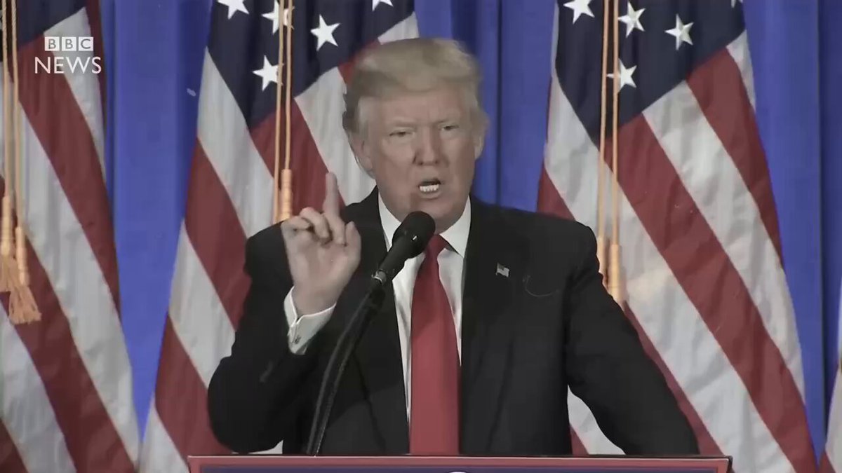 The image shows a man giving a speech at a podium with his hands raised while wearing a suit and tie. The backdrop features American flags, indicating that this event might be taking place in front of a government building or an official event. The caption suggests that there is a shift happening in the way media operates, as it now includes decentralized media networks like Google Chrome, which are powered by Bitcoin. This change could potentially impact how news and information are accessed and shared with the public.