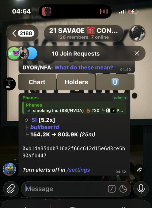 A Telegram chat screenshot from the '21 SAVAGE CON...' group showing a bot alert for 'Phanes' who is 'smoking lnu ($SI/NVDA)' with a 5.2x multiplier and bullbeartd trading data.