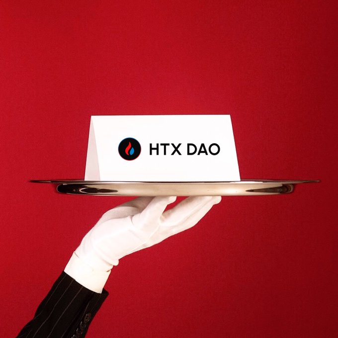 A white-gloved hand in a pinstripe suit holds a silver tray with a card displaying the "HTX DAO" logo against a red background.