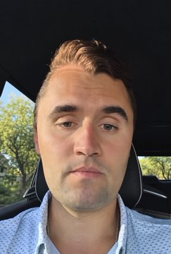A man takes a close-up selfie inside a car, wearing a light blue patterned button-up shirt. The image appears to serve as personal identification verification for the EtherFi platform's KYC (Know Your Customer) process.