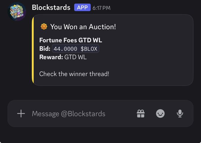 A Discord notification from the Blockstards app announces winning an auction for "Fortune Foes GTD WL" with a winning bid of 44.0000 $BLOX, prompting the user to check the winner thread. The image visually confirms the post's claim of securing a guaranteed whitelist spot for Fortune Foes through a competitive bidding process on Blockstards.