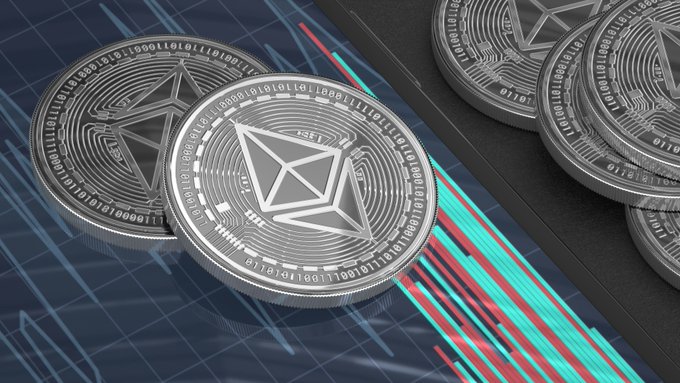 Close-up of silver Ethereum (ETH) physical coins resting on a stock chart with red and green candlesticks, symbolizing the cryptocurrency's market performance.