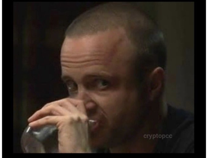 A close-up of a man drinking from a glass, featuring a 'cryptopcc' watermark in the corner.