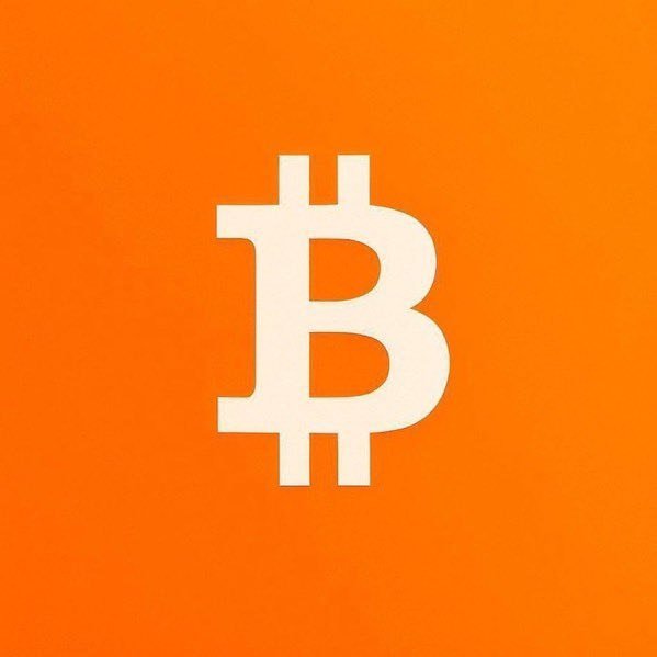 The image shows the Bitcoin (₿) logo in cream against a solid orange background, symbolizing the cryptocurrency at the center of the discussion in the post about the Crypto CLARITY Act advancing through U.S. legislation.