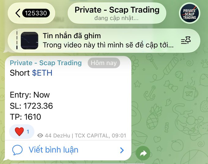 In the image, there's a phone screen with a message from someone named "Anh" that appears to be in another language. The text says something about "Tôi đã cảnh báo là đừng fomo nhé! Nhẹ nhâng hý tất võn lưu thế thế nhí!", which may not be entirely clear from the image. The message also includes a gif in another language and an overlay that says "Short nhé! Là đây báo là cóng các với hý nhên cường." It seems like there is a mix of text, images, and multimedia elements on the screen. The presence of this message suggests that the person who sent it might be talking about an online discussion or conversation involving various topics, possibly related to private trading or crypto currency markets.