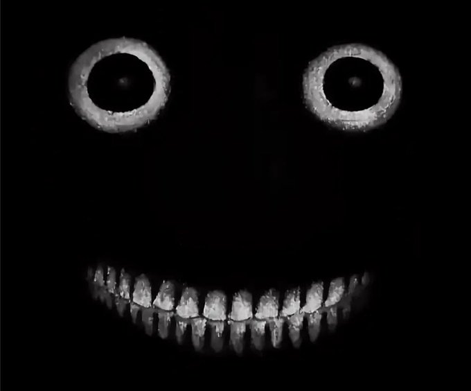 A wide grin with glowing eyes set against a black background, paired with new month goals listing targets like reaching 5,000 followers, releasing the 100th podcast episode with Madi, hosting an AMA space, and unveiling a new content style.