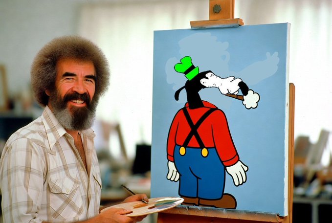 Bob Ross, the iconic painter, smiling while holding a palette beside his easel displaying a cartoon painting of Goofy in red and blue overalls.