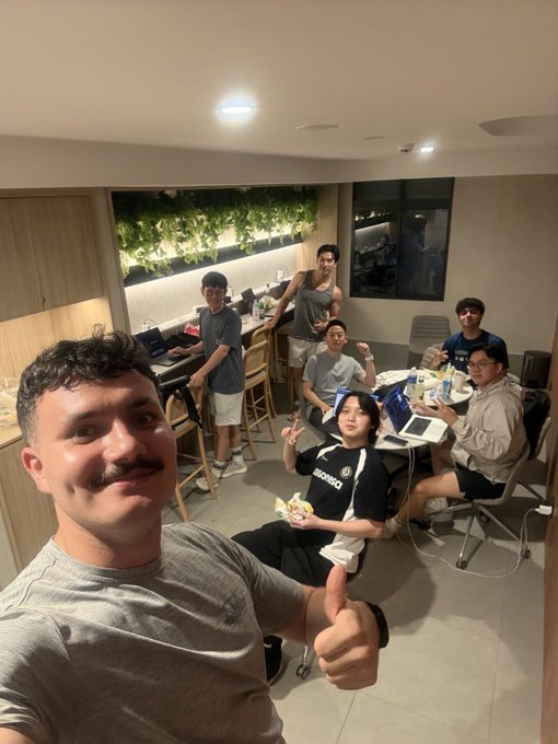 The team takes a well-deserved selfie together after wrapping up the @Lighter_xyz launch at Token2049, with the word "BEARSHARK" visible on one teammate's black t-shirt, celebrating their hard work over the past two weeks.