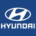 The Hyundai logo displayed as a silver emblem and text on a blue square background.