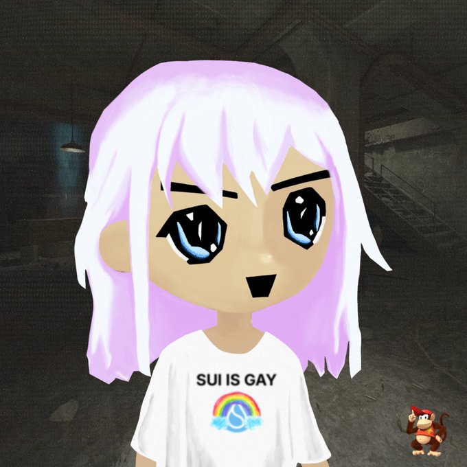 The image features a cartoon girl with white hair wearing a white t-shirt that reads "Sui is gay", accompanied by a monkey figurine. The girl's face has blue eyes, and she appears to be looking directly at the camera.