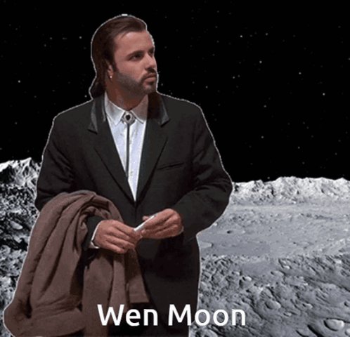 The image features a man dressed in a suit, standing on the moon with his hands together. The caption of the image reads "Wen Moon" above him.