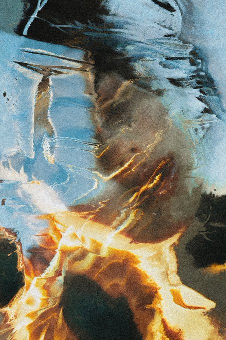 An abstract, mixed-media painting or digital artwork featuring swirling textures of dark brown, blue, and white, with streaks of warm golden and orange light creating a fiery effect at the bottom.