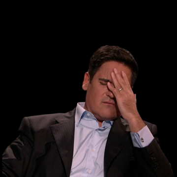 The image shows a man wearing a suit jacket sitting down with his hand over his head. The caption reads "INSIGHT: Bitcoin and Ethereum are the future of money," which suggests that the man might be discussing or analyzing cryptocurrency trends, as he is dressed in business attire.