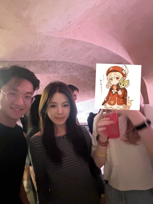 A man and woman pose together at the o1 exchange event at Seoul Gangnam's Zest Bar, where the woman holds a glass of red wine, capturing the upscale networking atmosphere described in the post about the "top-notch fine wines" and handsome founder Jerry.